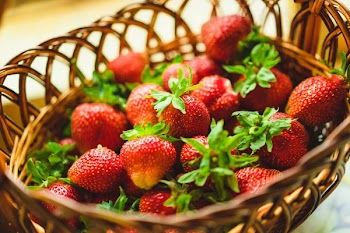 Close-up view of fresh strawberries in a basket