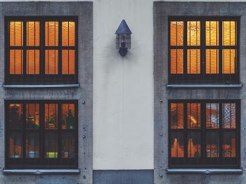 close view of white wall near window panels