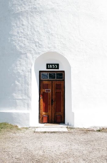 closed 1852 wooden door at daytime