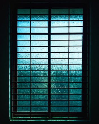 Closed Black Metal-framed Frosted Glass Windowpane