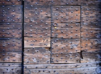 Closed Brown Wooden Door With Metal Stud
