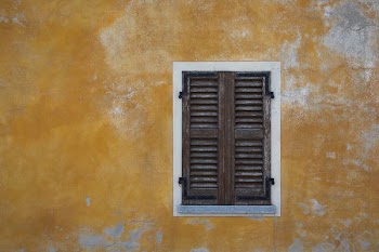 closed brown wooden window
