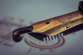 Closed Up Photography of Brown and Black Weapon Hilt
