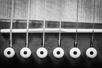 Closeup Grayscale Photo of Acoustic Guitar