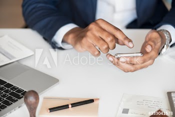 Closeup of a businessman using a mobile phone