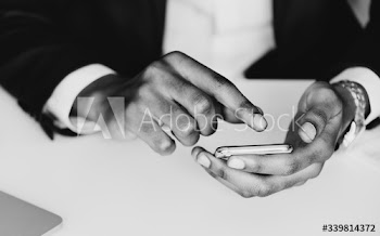 Closeup of businessman using mobile phone