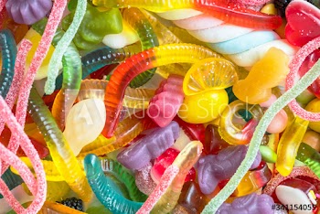 Closeup of colorful assorted jelly worms and other candies