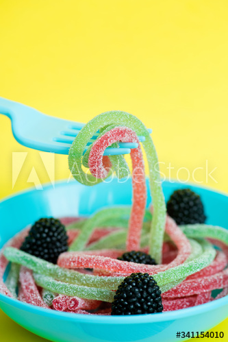Closeup of colorful jelly worms shown as spaghetti
