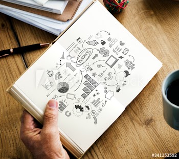 Closeup of hands holding open novel and coffee cup