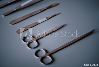 Closeup of surgery knives set isolated