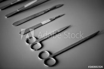Closeup of surgery knives set isolated