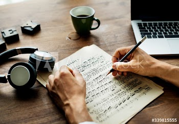 Closeup on casual man composing music