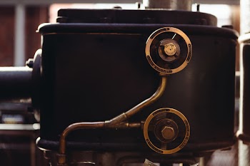 Closeup Photo of Black and Gray Home Appliance