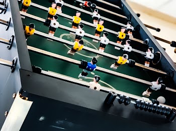 Closeup Photo of Black and Green Foosball Table