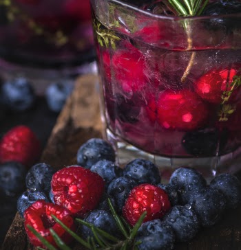 Closeup Photo of Blueberries Near Clear Drinking Glass