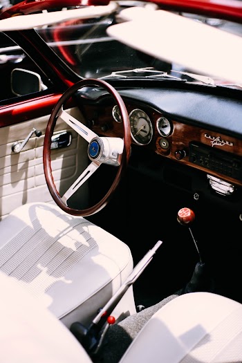 Closeup Photo of Brown and Gray Vehicle Steering Wheel