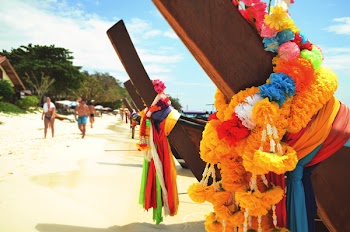 Closeup Photo of Brown Wooden Fence With Multi-colored Fabric Tie