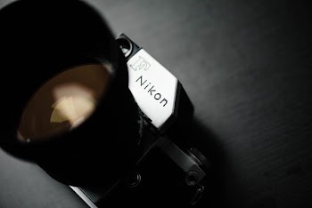 closeup photo of gray and black Nikon camera
