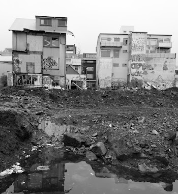 Closeup Photo of Lined Concrete Houses