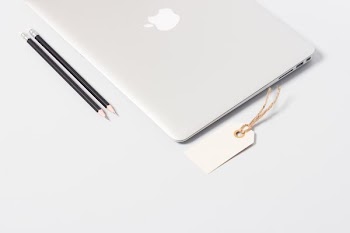 closeup photo of MacBook Air near pencils