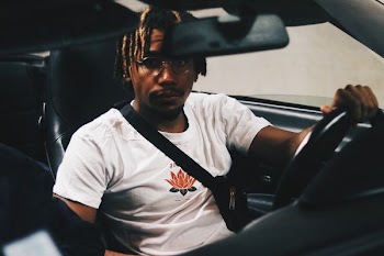 closeup photo of man driving car
