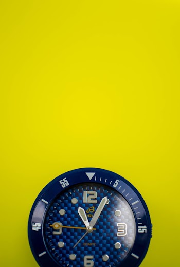 Closeup Photo of Round Blue Analog Watch