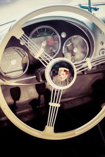 closeup photo of white car steering wheel