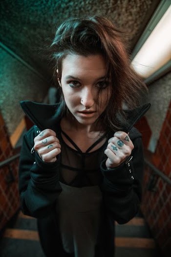 closeup photo of woman wearing black coat