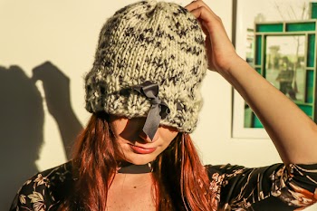 Closeup Photo of Woman Wearing White and Black Knit Cap