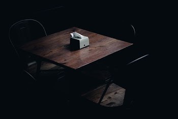closeup photo of wooden table and chairs