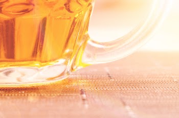 Closeup Photography of Clear Glass Beer Mug Filled With Yellow Liquid