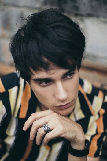 Closeup Photography of Man Wearing Black-yellow-and-orange Striped Polo Shirt