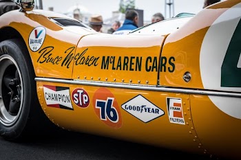 closeup photography of orange McLaren car