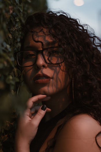 Closeup Photography of Woman Wearing Black Framed Sunglasses