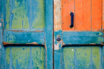 closeup view of blue and green wooden door