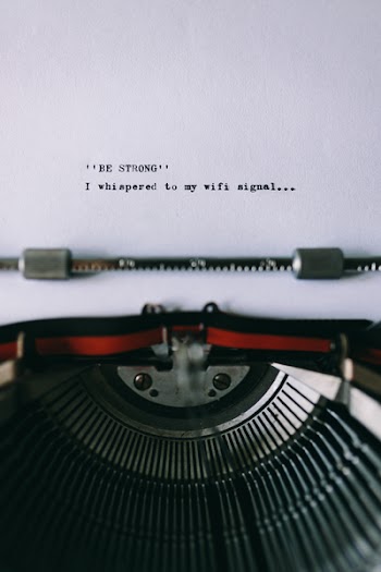 Closeup view of typing quotes on the old typewriter