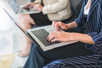 Co Workers Using Laptops