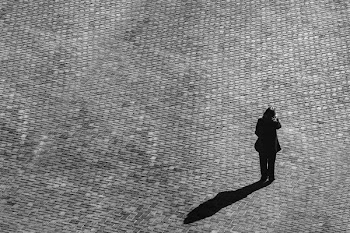 Cobblestone And Person With Shadow