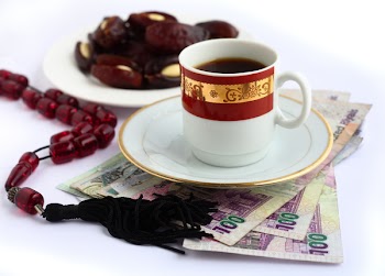 Coffee, Arabian high-value bank notes, a plate of dates and worry beads - the essentials for doing business in the arab world