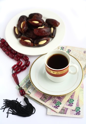 Coffee, Arabian high-value bank notes, stuffed dates and worry beads - the essentials for doing business in the arab world