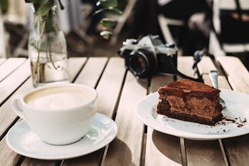 Coffee, chocolate cake and an analog camera