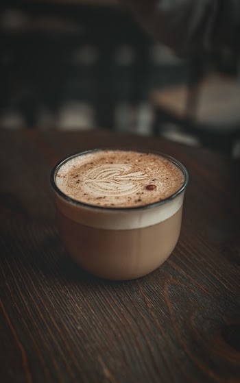 Coffee Cup on Brown Wooden Table