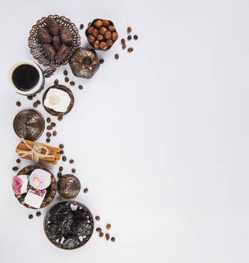 Coffee cup with eastern sweets and hazelnuts