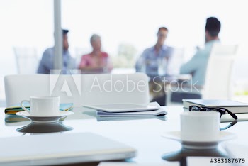 Coffee cups on conference room table