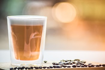 Coffee in Drinking Glass With Black Beans