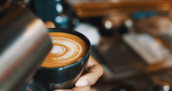 Coffee Latte in Black Ceramic Cup