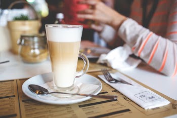 Coffee Latte with Frothy Milk in Tall Glass