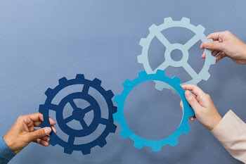 Cogwheel business productivity symbol held by… | Free stock photo | High Resolution image