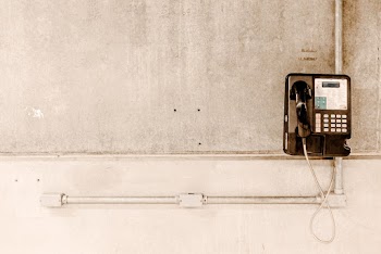 Coin Operated Telephone on the Wall