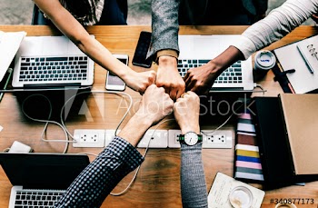 Colleagues giving a fist bump